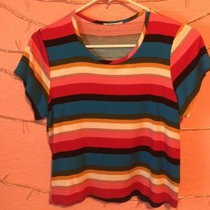 A short-sleeve thrifted rainbow colored top